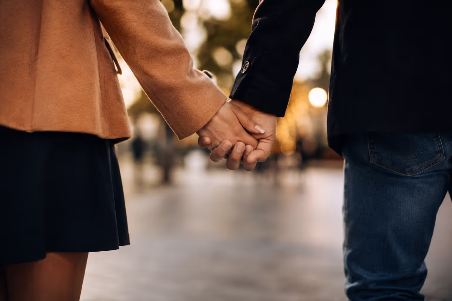 Couple holding hands showing physical affection and connection